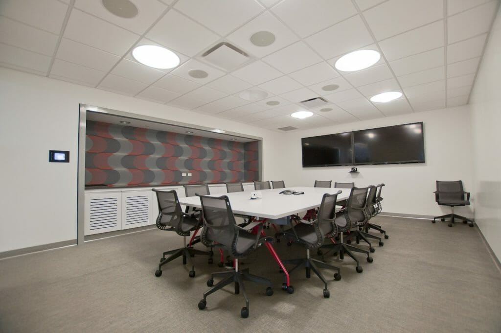 large conference room with AV integration and mounted screens